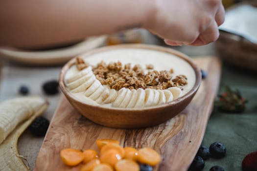 a bowl of yogurt with sliced bananas