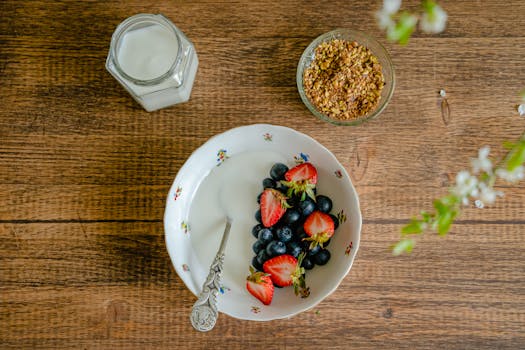 colorful smoothie bowl topped with fruits and seeds