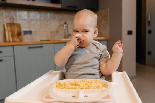 happy baby with a spoon