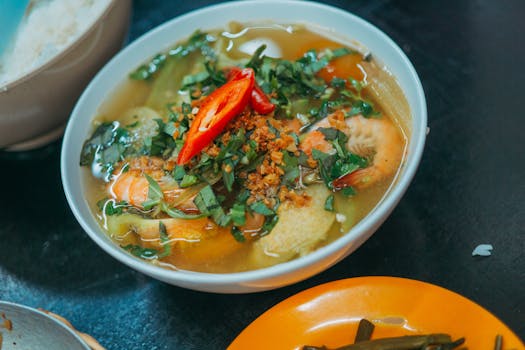 A vibrant bowl of miso soup with vegetables